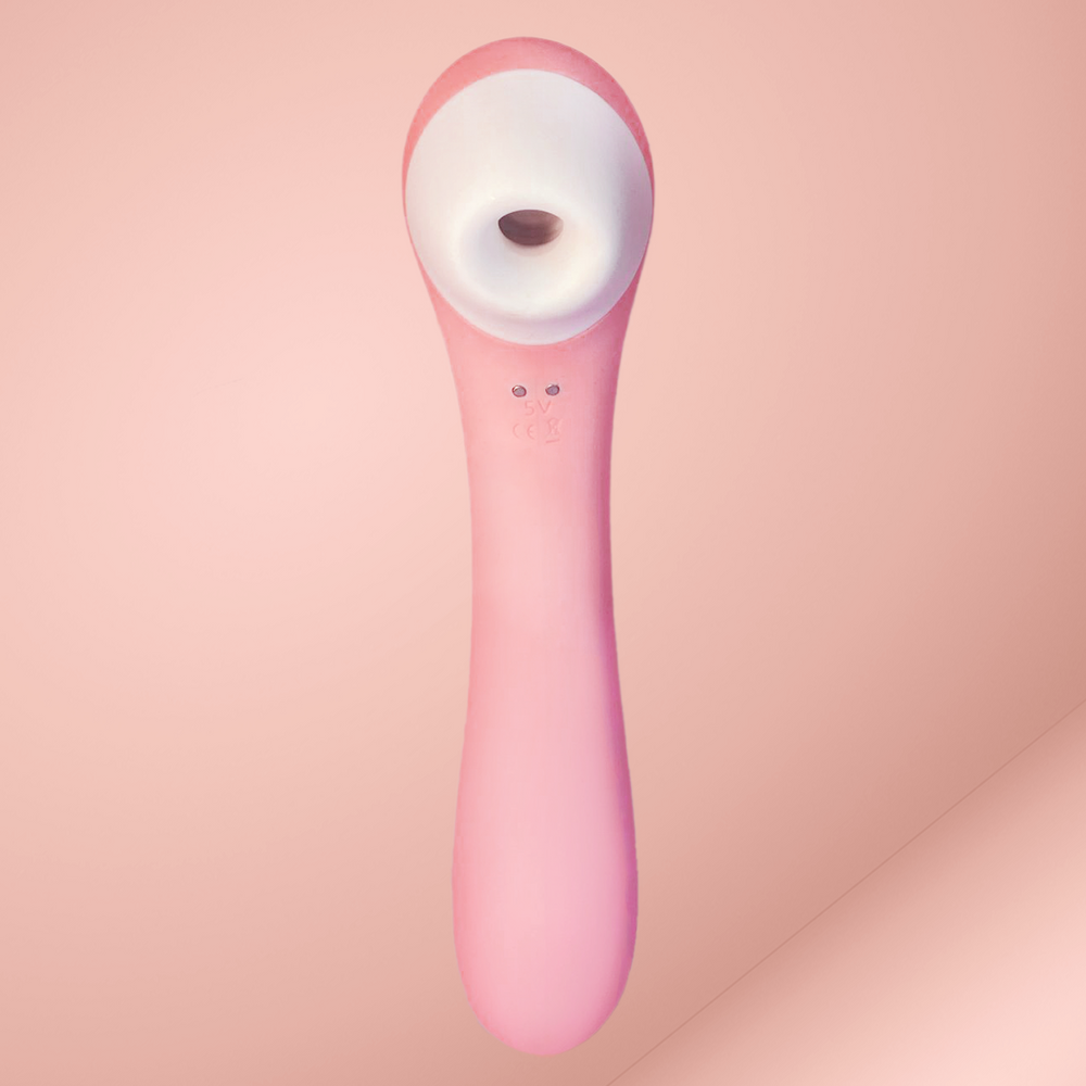 Rosa Klitorisstimulator auf rosafarbenem Hintergrund