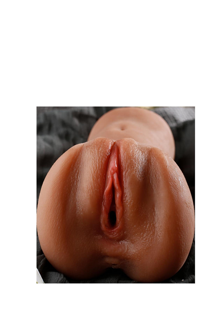 Sexpuppen-Torso auf grauem Hintergrund